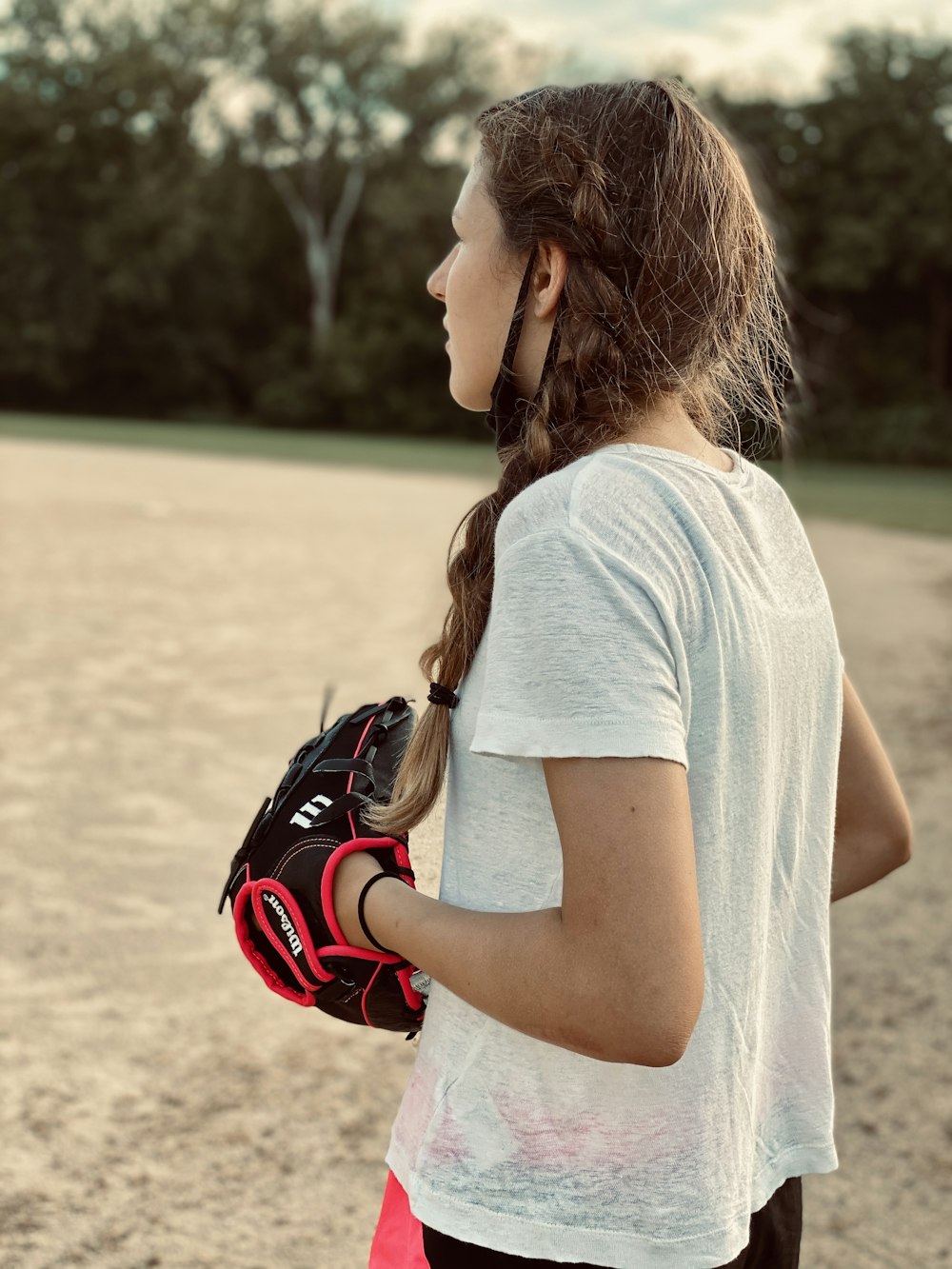 a person wearing a white shirt and gloves