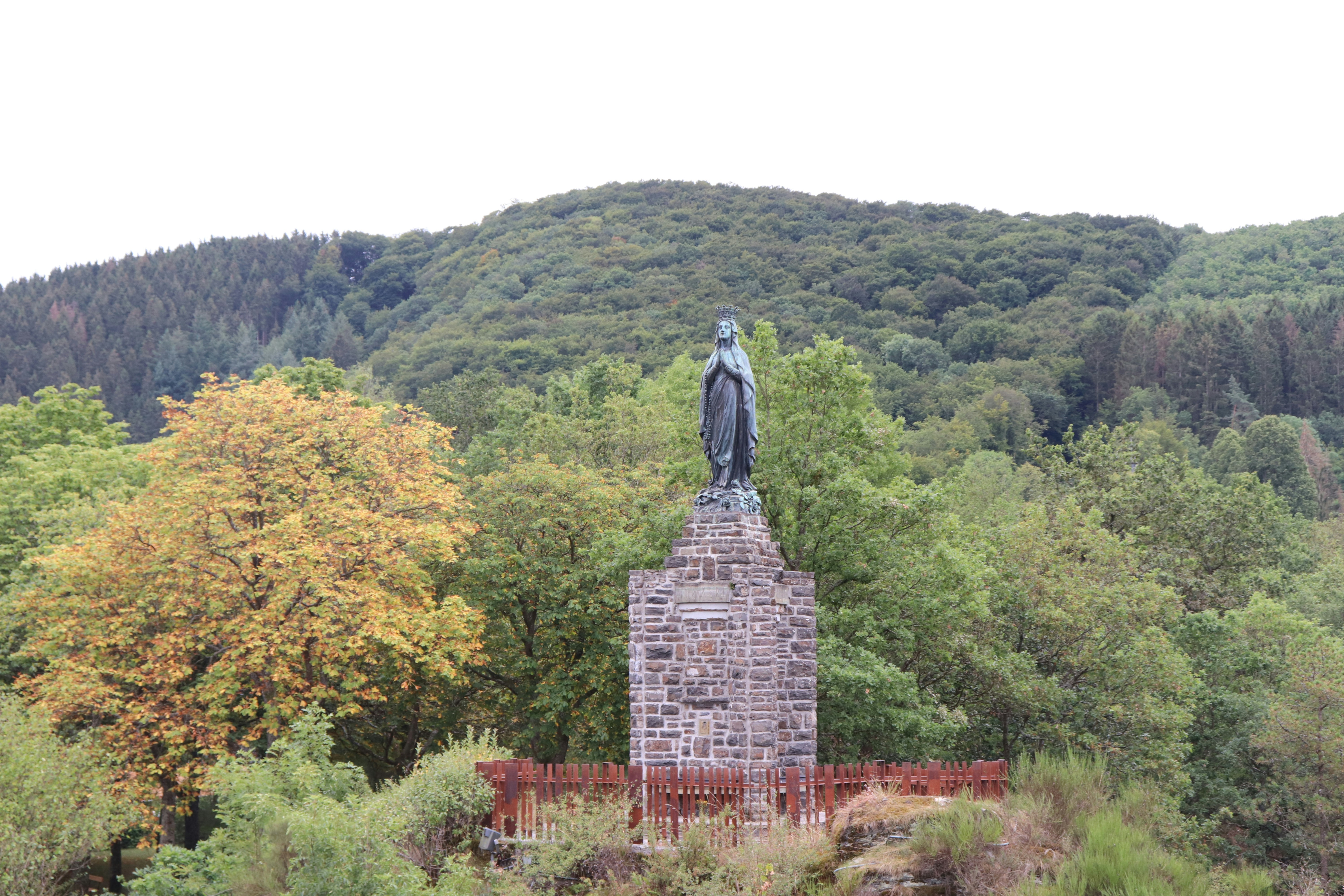 a statue in a forest