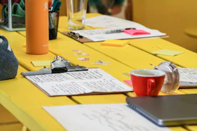 a table with a cup and a pencil on it
