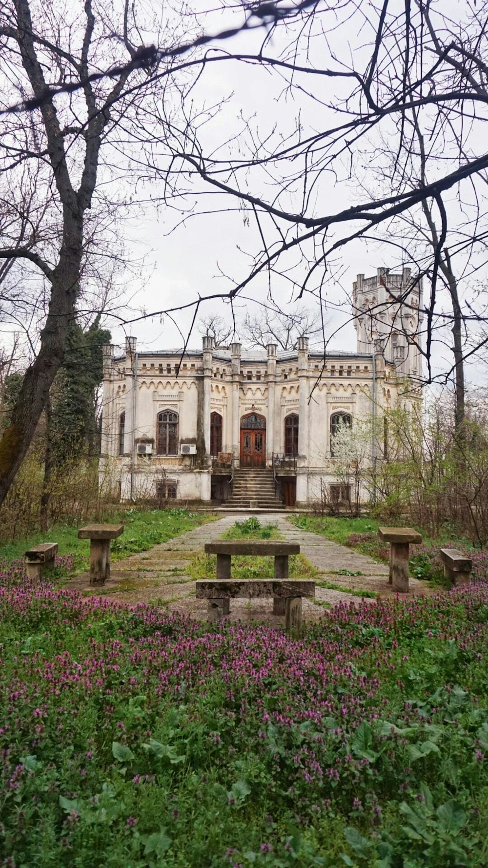 a building with a large garden in front of it