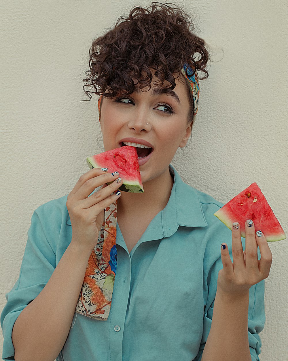 a woman eating a donut