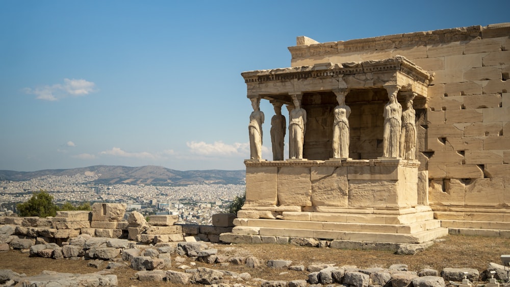 a stone building with statues