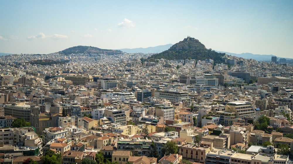 a city with a mountain in the background