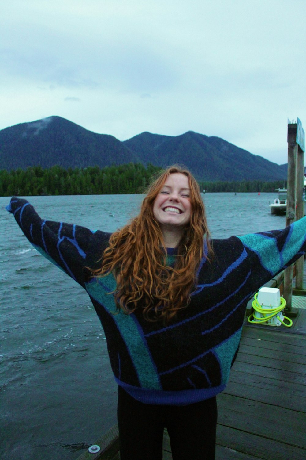 a woman standing on a dock