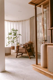 Modern minimalistic living room with soft natural light and calm decor.