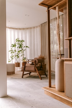 Minimalist living room with natural wood furniture and soft lighting