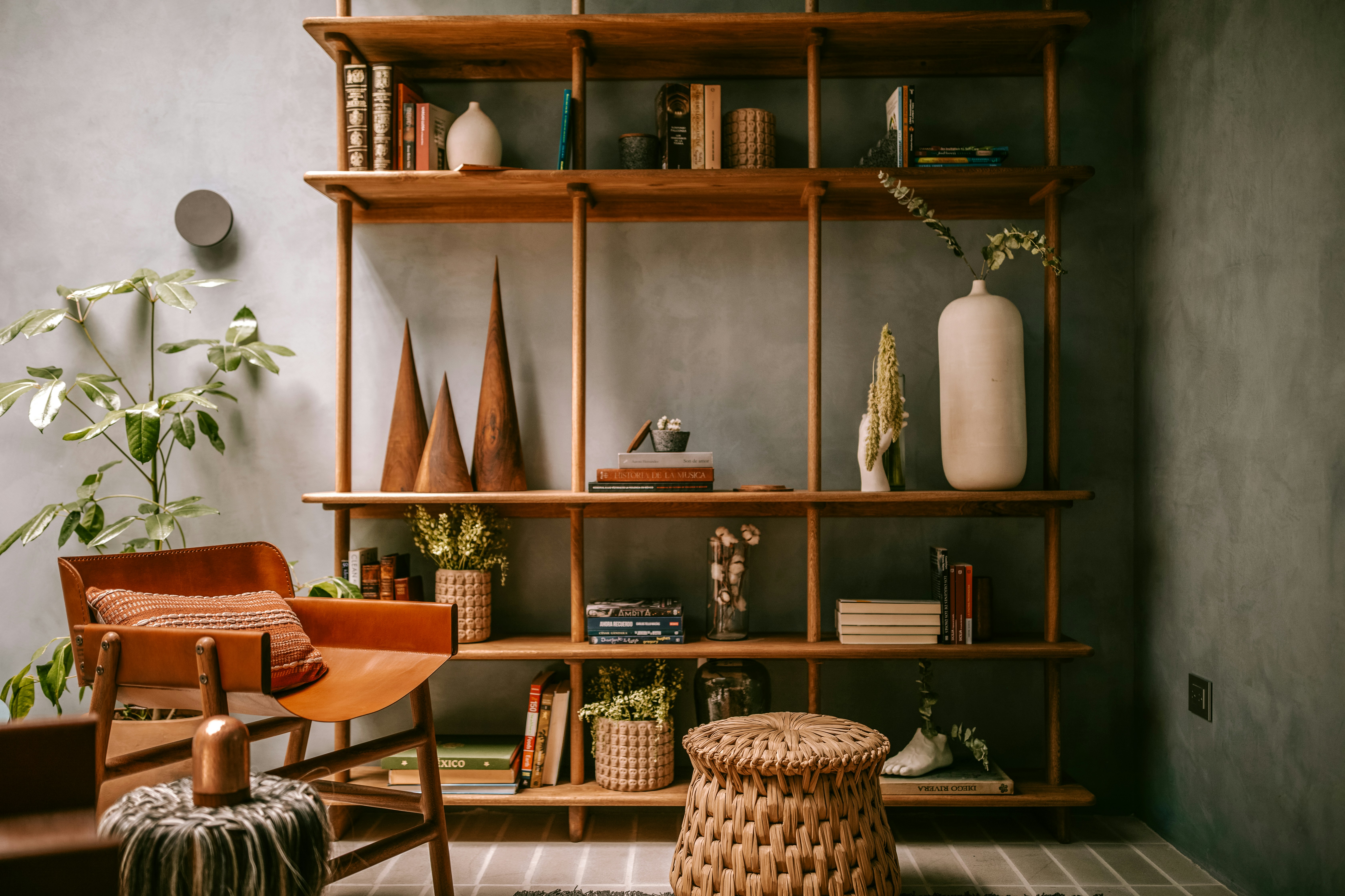 a bookshelf with books and a chair