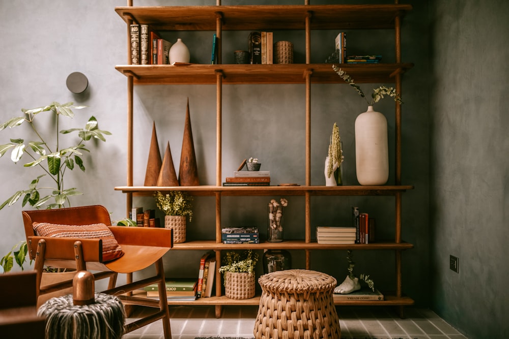 a bookshelf with books and a chair