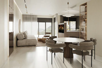 An inviting living area showcasing minimalist furniture and tasteful decor.