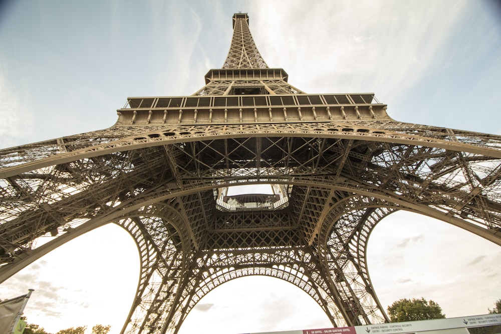 a large metal tower with Eiffel Tower in the background