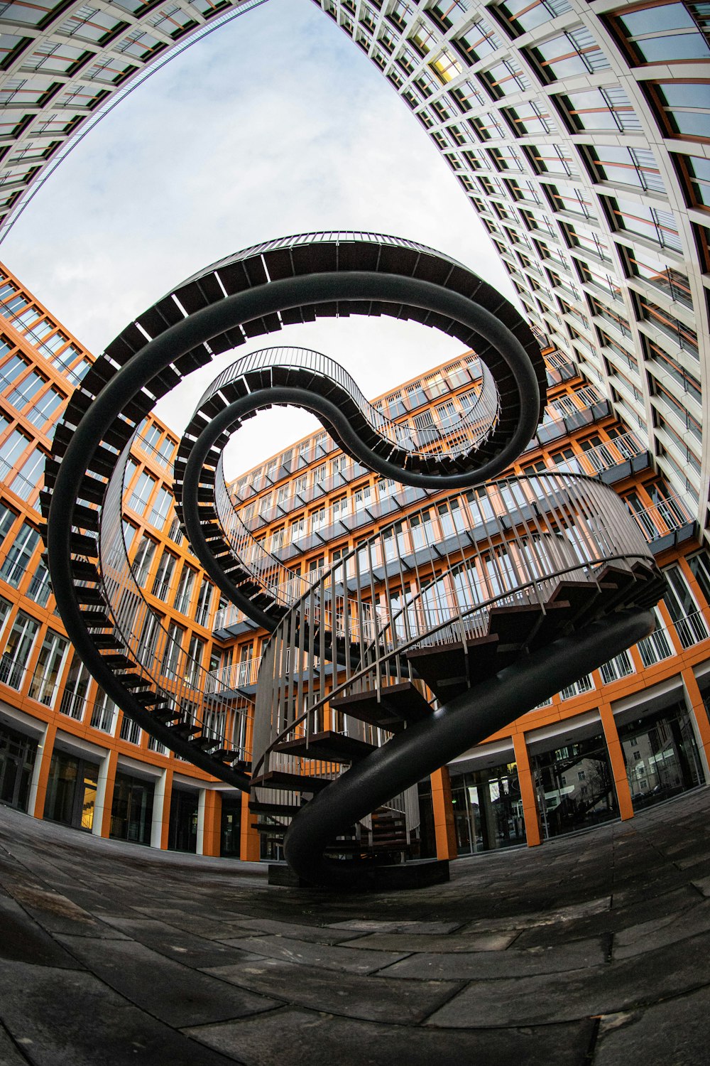 a large spiral staircase in a building