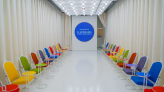 a room with chairs and a screen