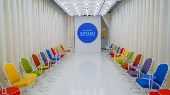 a room with chairs and a screen