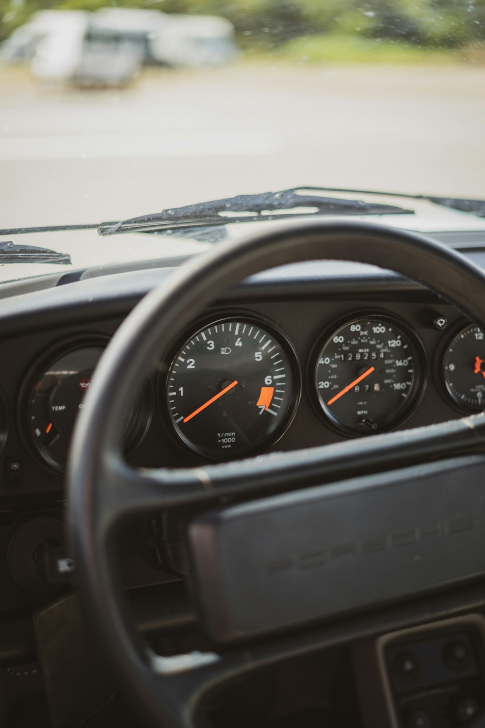 a car dashboard with a speedometer