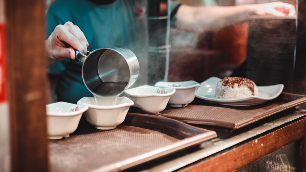 a person cooking food on a stove