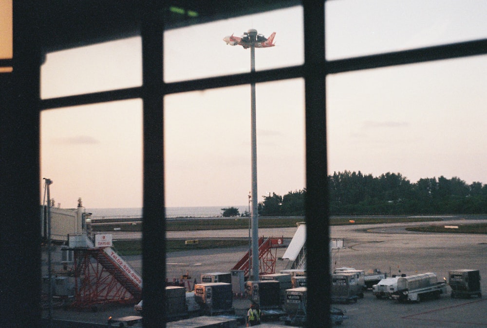 a view of a parking lot through a window of a building