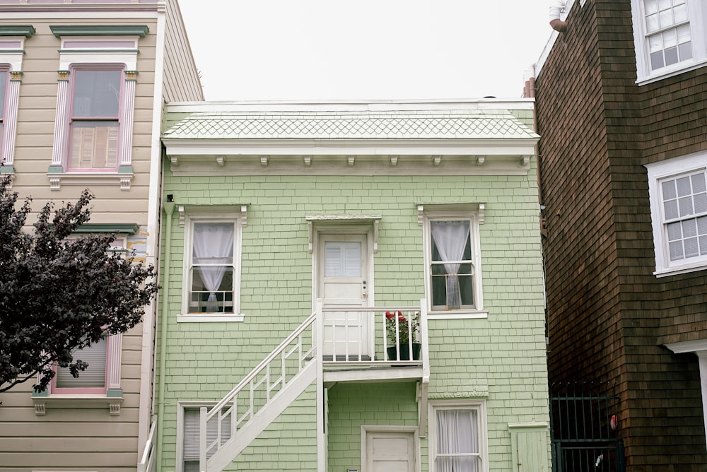 a green house with a white door