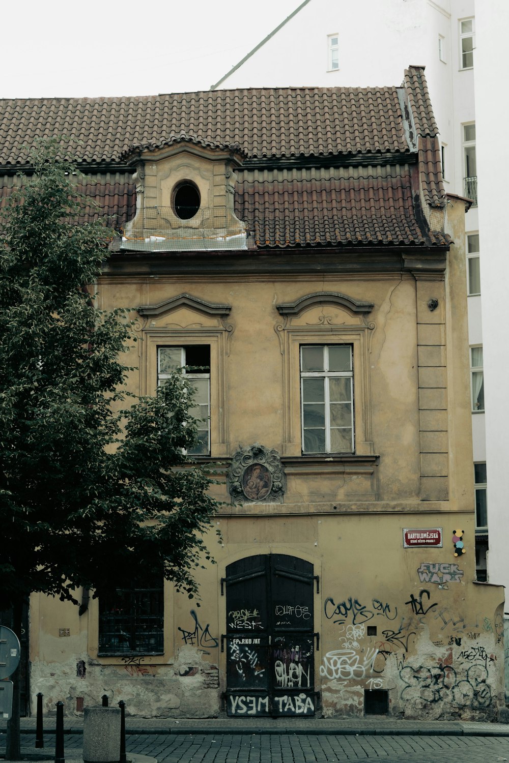 a building with a tree in front of it