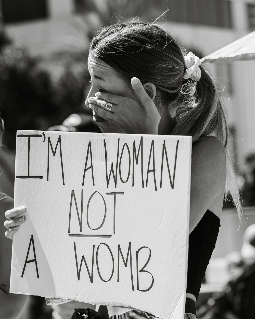 a person holding a sign