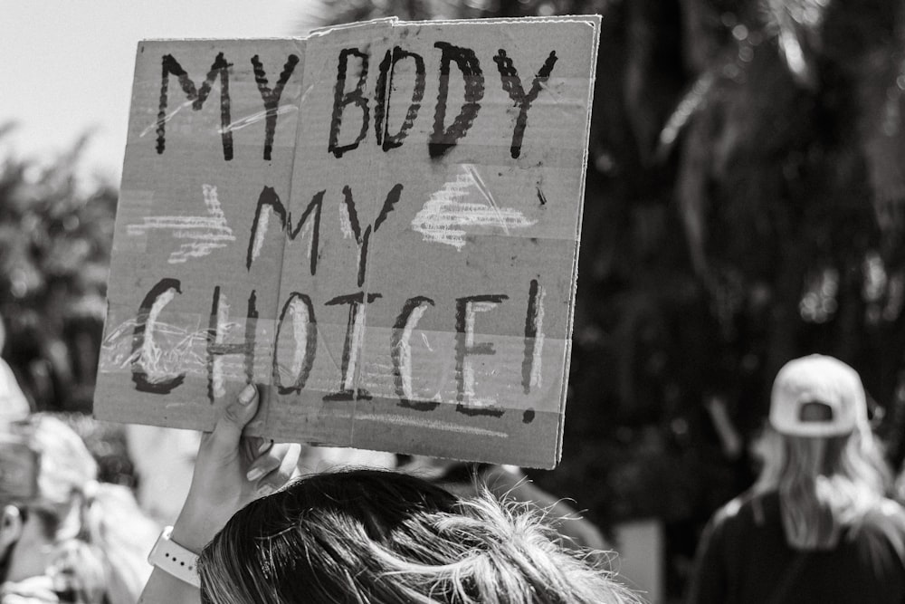 a person holding a sign