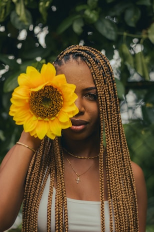 a woman with a flower in her hair