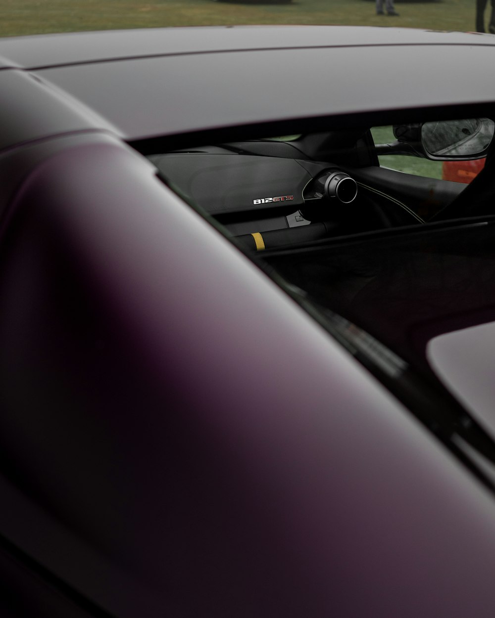 a car's dashboard with a black steering wheel