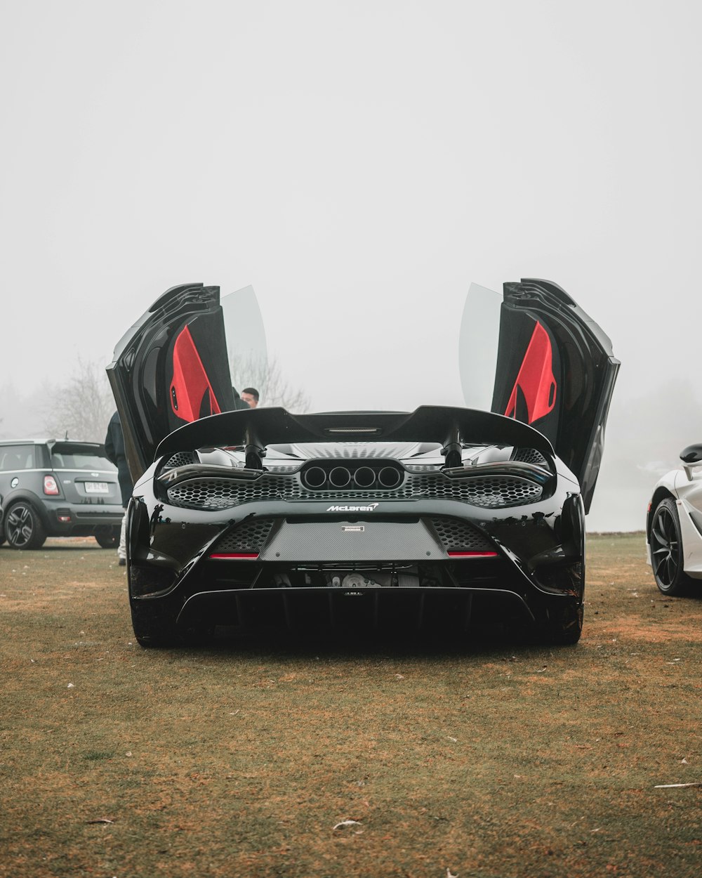 a black sports car with its doors open