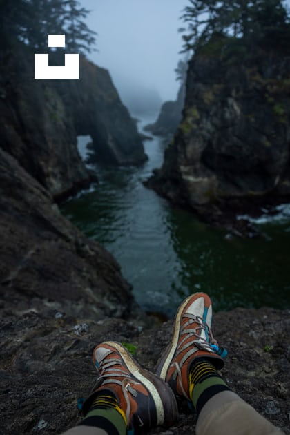 A person's feet on a rock ledge above a river photo – Free Grey Image ...