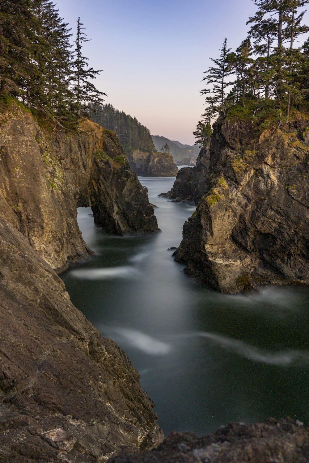 a river flowing between rocky cliffs