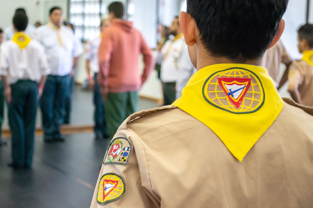 a person wearing a yellow shirt