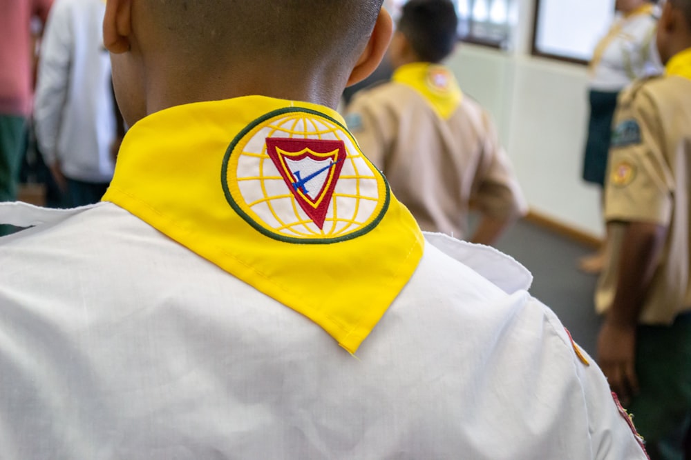 a person wearing a yellow shirt