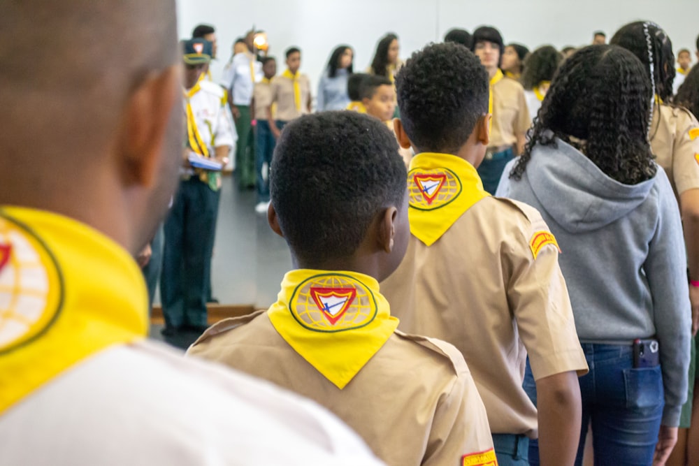 a group of people in yellow shirts