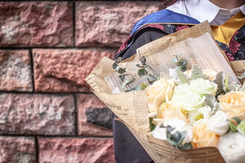 A graduation ceremony decorated with elegant floral arrangements.