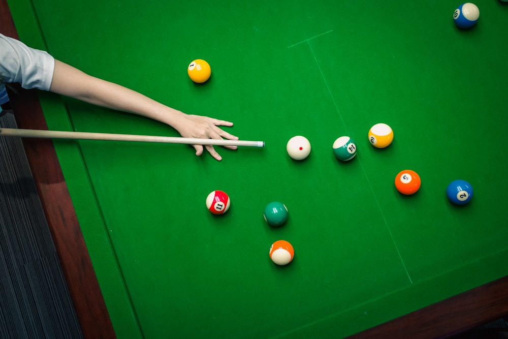 a person playing pool