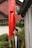 a person standing in front of a red pillar