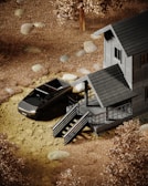 A vibrant red pickup truck in front of a rustic cabin.