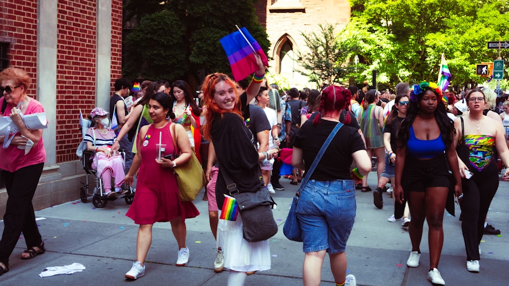 a group of people walking on a street