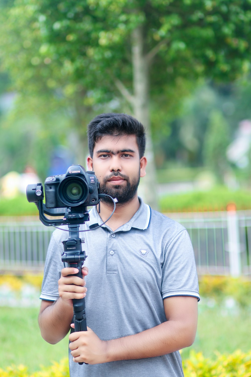 a man holding a camera