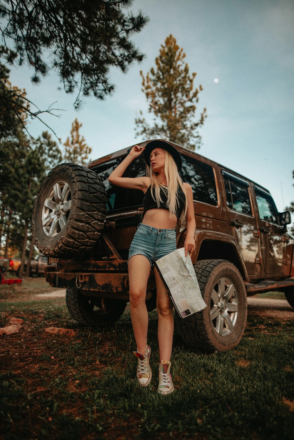 a person standing next to a car