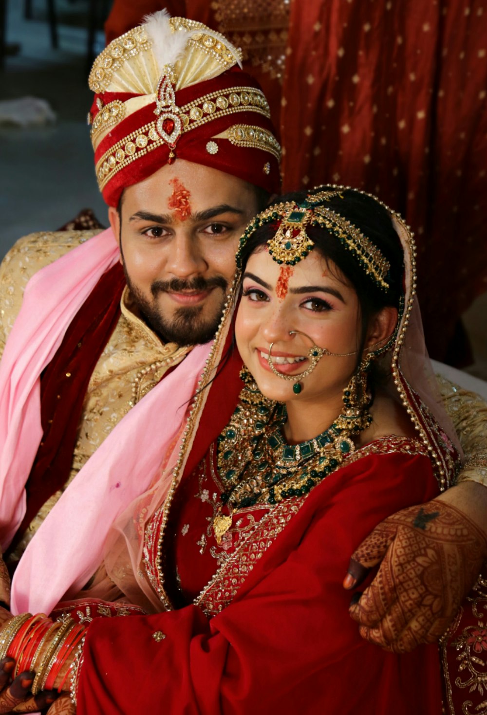 a man and woman wearing traditional clothing