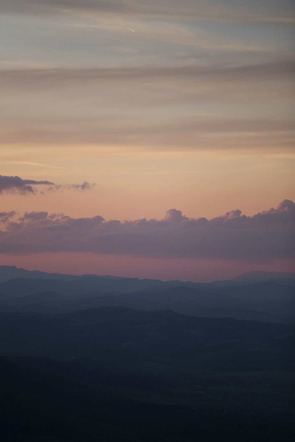 a view of the mountains at sunset