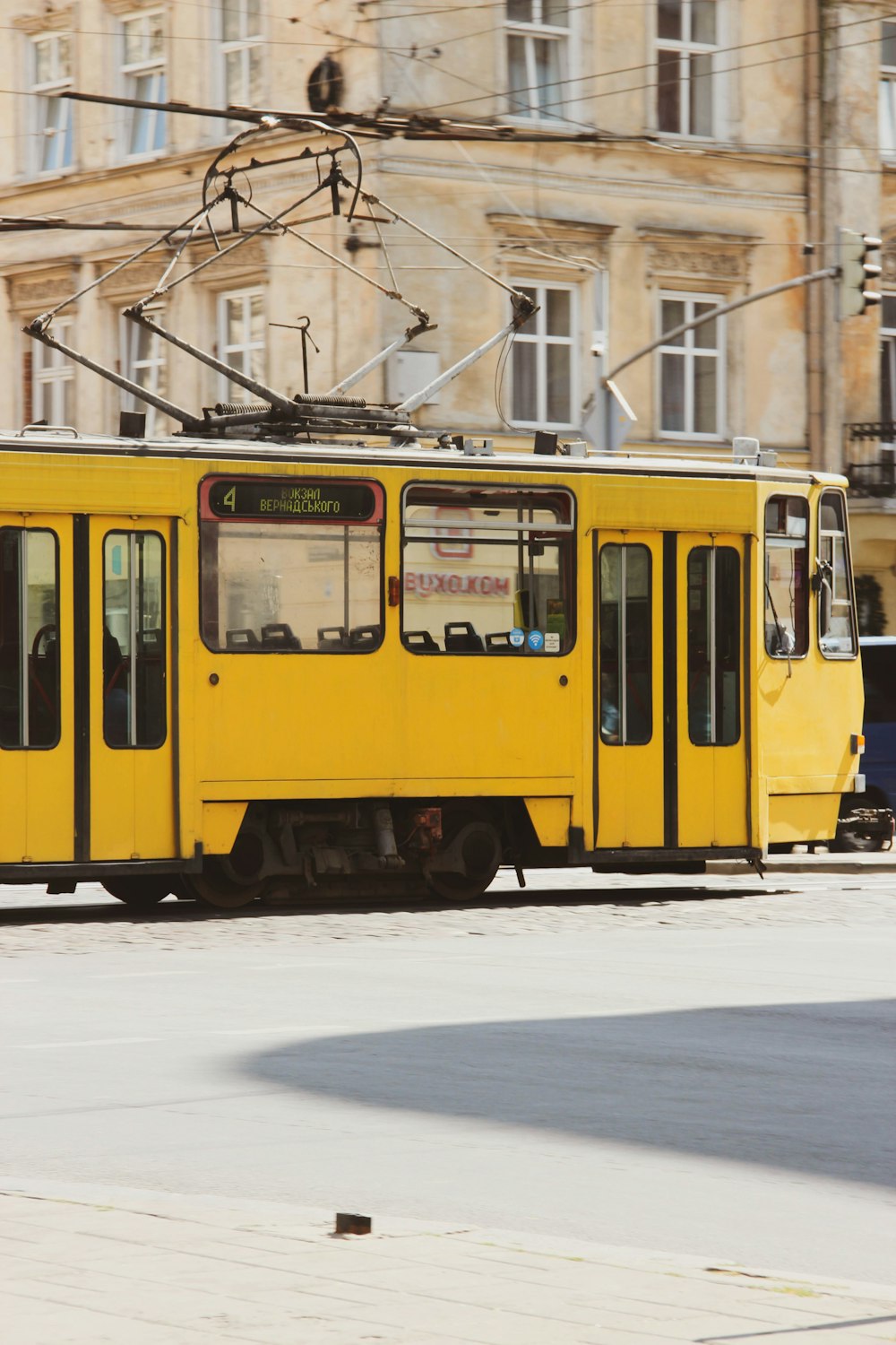 a yellow train on the tracks