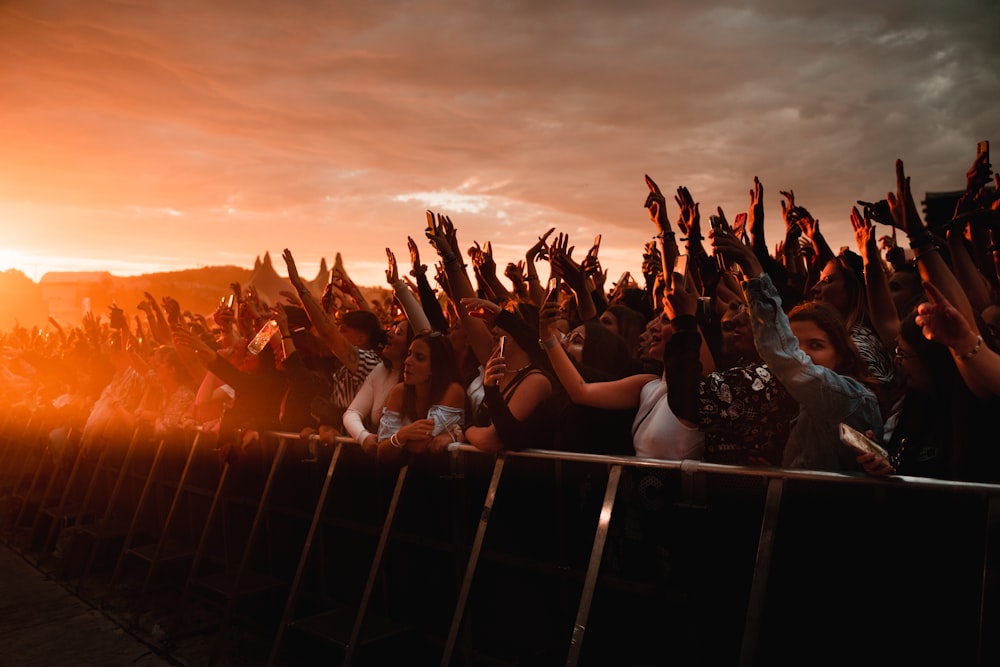 a group of people raising their hands