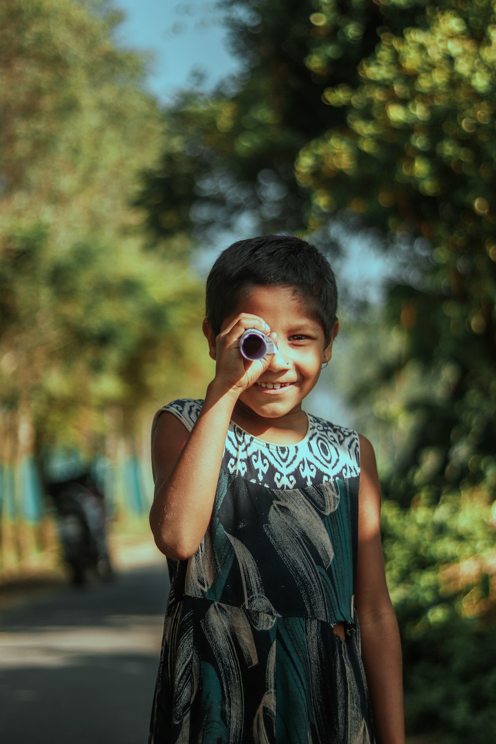 a boy holding a camera