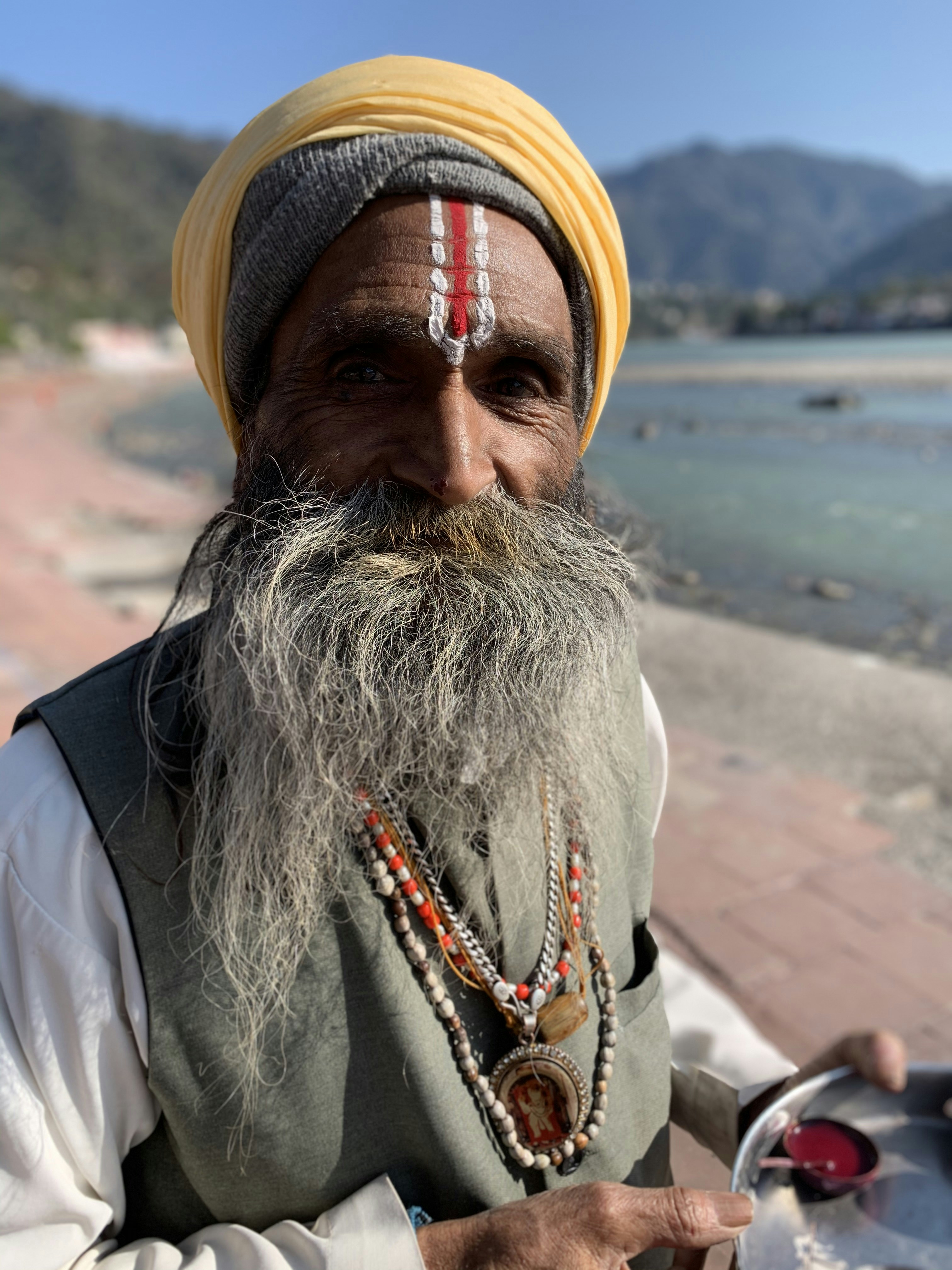 Indian man elder with wise kind expression in church setting