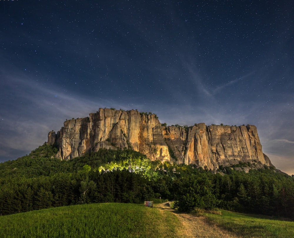 a mountain with a rainbow in the sky