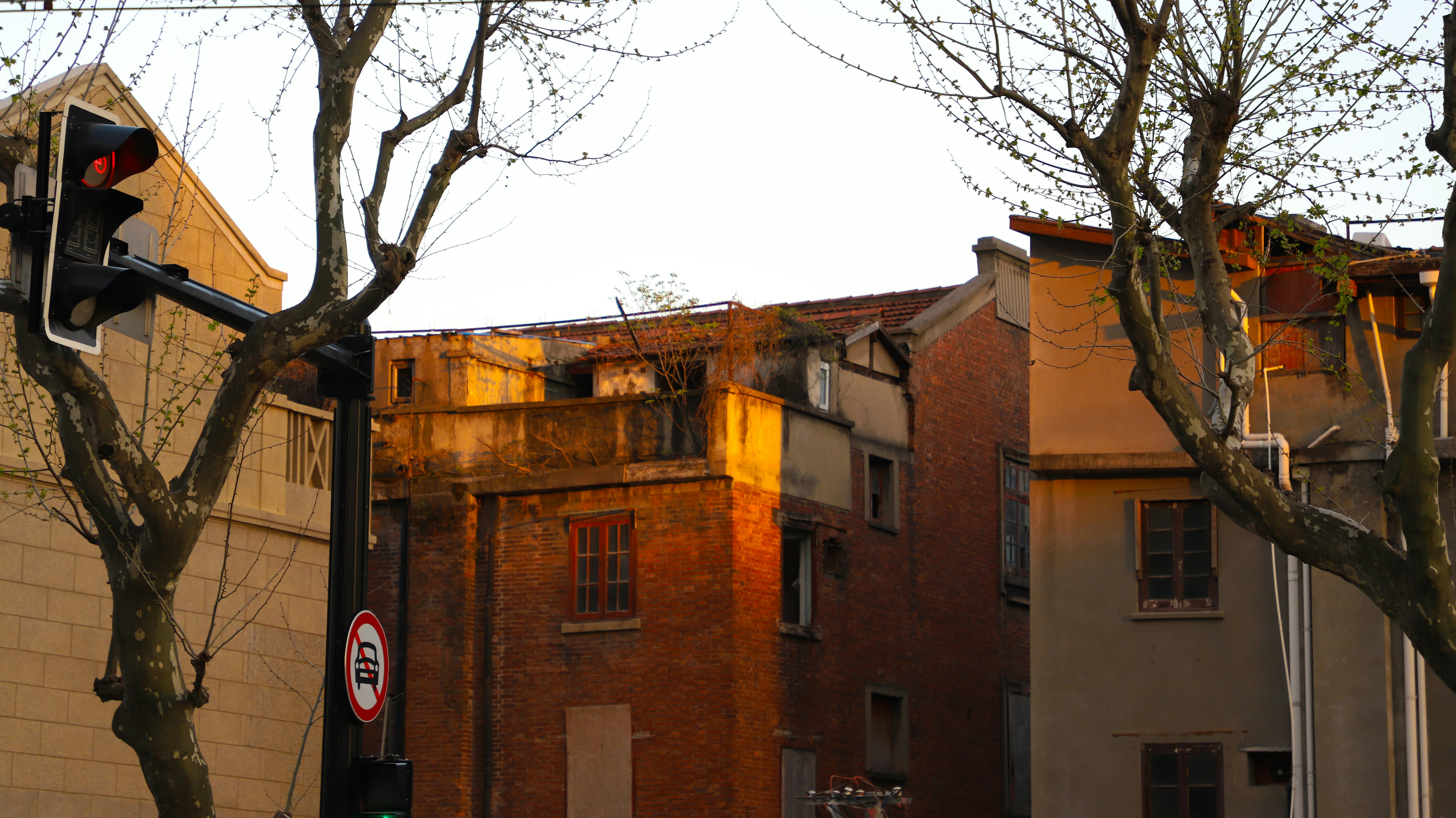 A street light in front of a brick building photo – Free 上海市 Image on ...