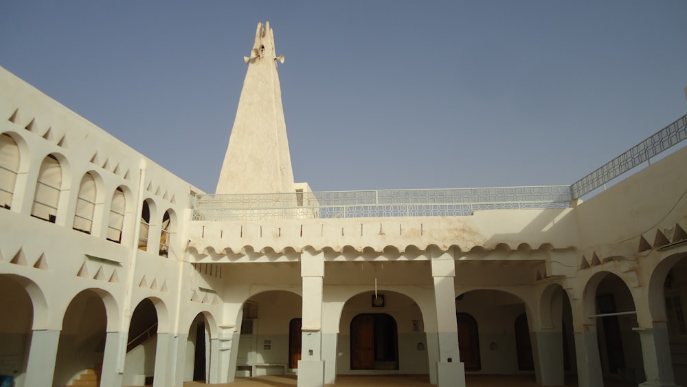 a large white building with a tall tower