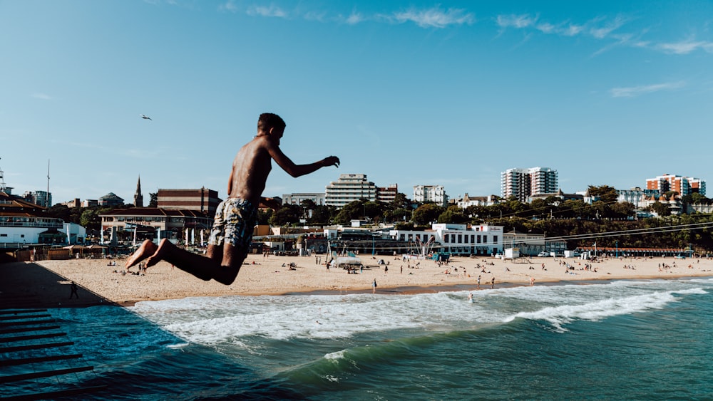 a man jumping into the water