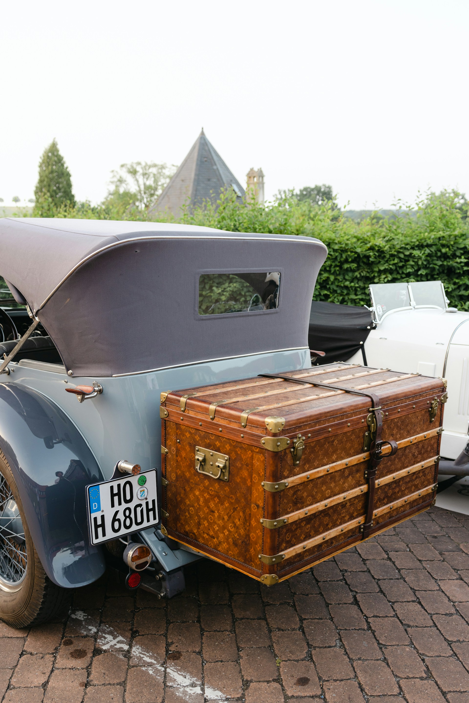a suitcase sits on top of a truck